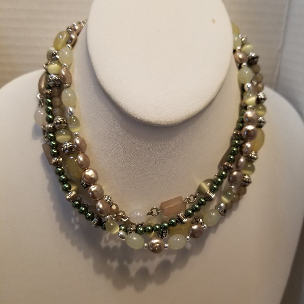 Layered four strands silver tone 14" with a 3" ex. green yellow white beaded nec